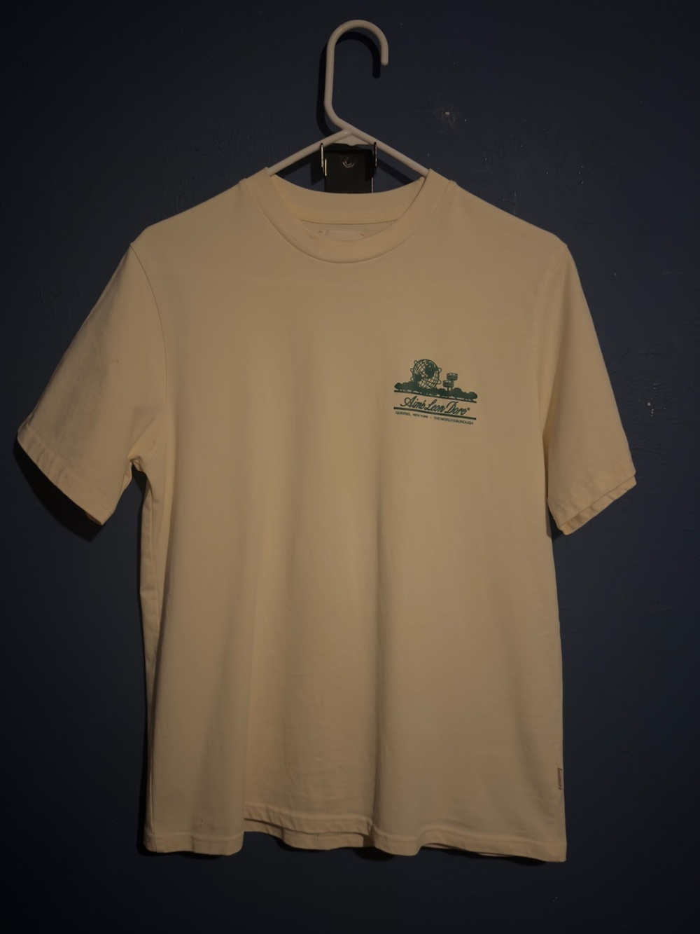Aime Leon Dore Cream Short Sleeve Tee with Green Chest Graphic ALD